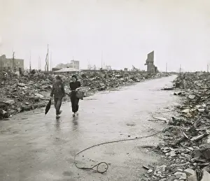 Lcgr1404: Two Japanese civilians walk through cleared path