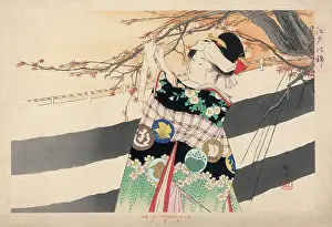 Elaborately: Japanese girl hangs a message on a tree