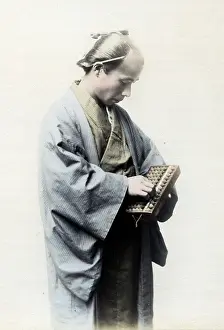Abacus: Japanese man counting on an abacus