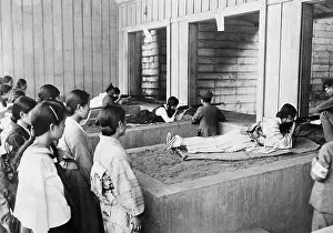Typewriters: Japanese office workers during target practice, 1934