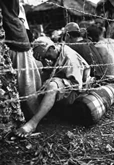 Ryukyu: Japanese soldier sits dejectedly in a prisoner