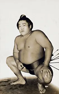 Squat: Japanese Sumo Wrestler in traditional pose