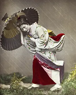 Rainstorm: Japanese woman in a rainstorm
