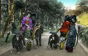 Collapsible: Two Japanese women get into their rickshaws