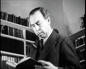 Priestly: J.B. Priestly Reading and Smoking a Pipe