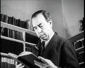 Priestly: J.B. Priestly Reading and Smoking a Pipe