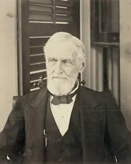 C1885: Jefferson Davis, seated, facing front, during portrait sessi