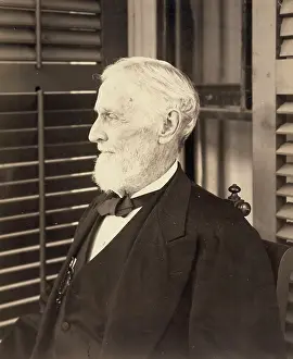 C1885: Jefferson Davis, seated, facing left, during portrait sessio