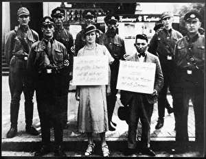 Placards: JEWISH/GERMAN COUPLE