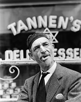 Storefront: Jewish man standing in front of a storefront