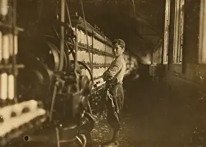 Looked: John Dempsey working in mule-spinning room 1909