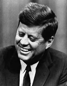 Proliferation: John F. Kennedy, laughs after stumbling ?