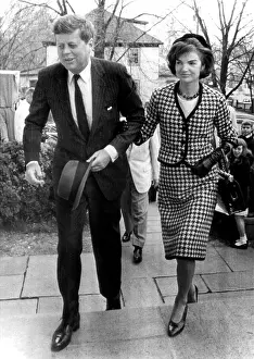 Pinstripes: John and Jacqueline Kennedy arrive to attend ?