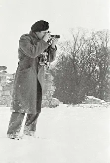 John taking photos in snow