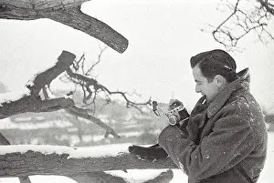 John taking photos in snow