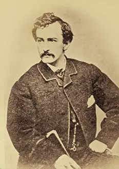 Wilkes: John Wilkes Booth, half-length portrait, facing left and hol