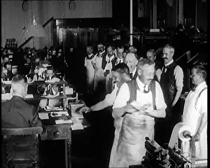 Printers: Journalists and Screen Printers At Work in a News Room