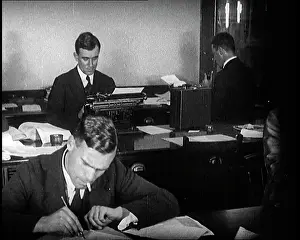 Typing: Journalists At Work Typing, Reading, and Making Notes