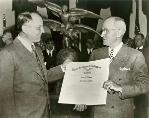 Contributions: Juan T Trippe left is presented with the Harmon Trophy