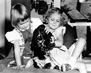 Checkers: Julie and Tricia Nixon playing with their ?