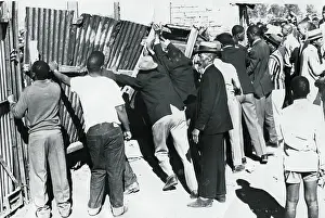 Ensured: June 8 1972 - People inside the ground struggle to