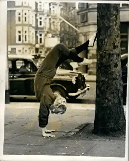 Pounding: June Ritchie, actress, doing handstand, London