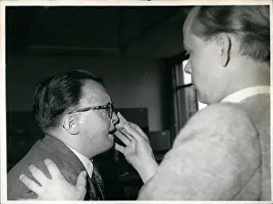 Disfigured: Karl Heinz Heppe, plastic surgeon, with war victim Basille