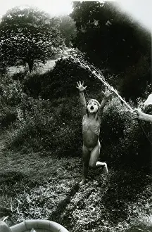 Roger Mayne: Katkin Under the hose, Rose Cottage