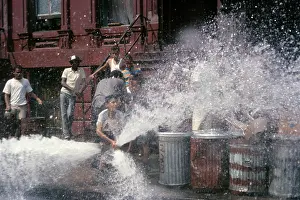 Hydrant: Kid at Open Fire Hydrant Making Water Spray Harlem New