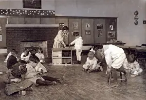 Schoolmarm: Kindergarten children in Horace Mann School ?