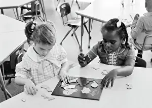Solutions: Two Kindergarten Preschool Girls working on Solving