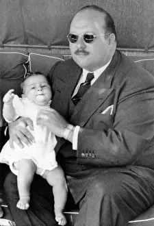 Fouad: Former King Farouk of Egypt holding baby ?