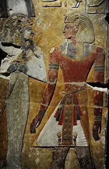 Pharaoh: King Seti I in front of the God Osiris. Fragment of a pillar