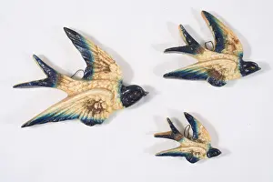 Moulded: Kitsch ceramic, set of flying swallows, wall