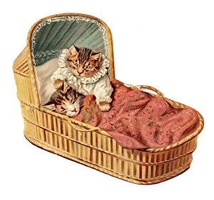 Cradles: Two kittens in a cradle on a cutout greetings card