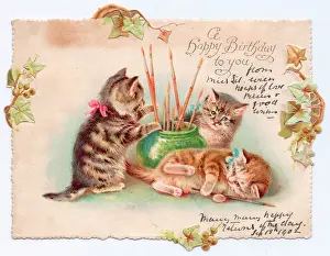 Paintbrushes: Three kittens on a cutout birthday card