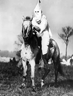 Intimidation: Klansman doing sentry duty near the Klan ?