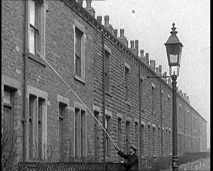 Poll: A Knocker Upper Uses A Long Poll To Rap Against
