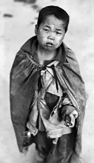Haggard: Korean War: A young Korean boy begging for ?