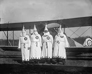 Adorns: The Ku Klux Klan, one with flight goggles, ?