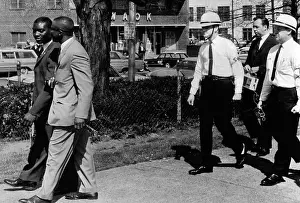 Intimidation: A Ku Klux Klan Security Patrol walk behind ?