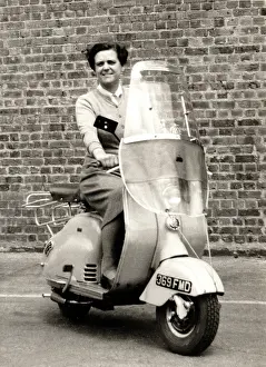 Michael Cole: Lady on 1950s scooter