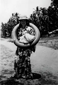 Amusing: Lady on the beach with a rubber ring