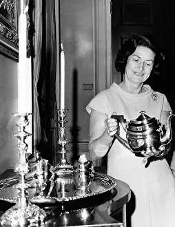 Issac: Lady Bird Johnson holds a silver teapot ?