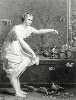 Aviary: A lady feeds her pet birds