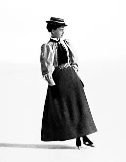 Backward: Lady figure skater doing a backward outside edge
