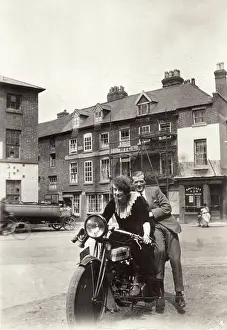 Headlamp: Lady & gentleman on a 1920 Triumph motorcycle