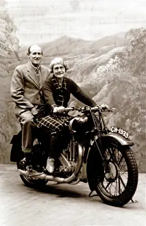 500cc: Lady and gentleman sat on a 1929 Coventry Eagle motorcycle