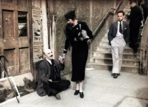 Blindness: Lady giving beggar money