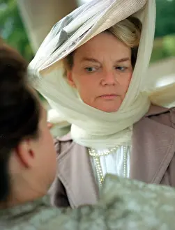 Frowning: LADY AND LADY'S MAID